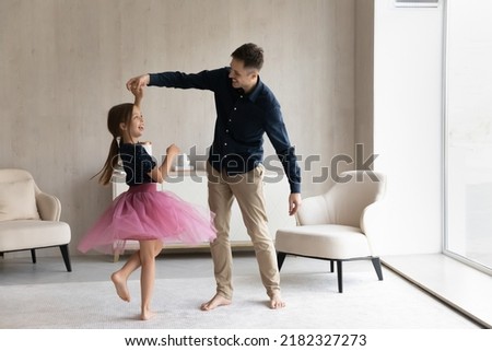 Similar – Image, Stock Photo Father with daughter barefoot on grass