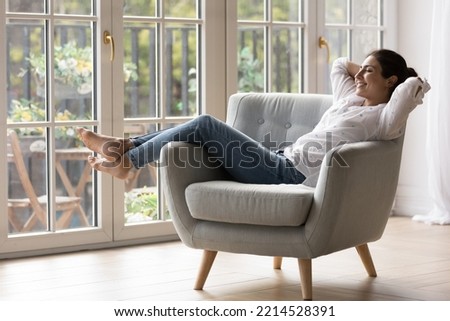 Similar – Image, Stock Photo Ethnic woman relaxing near rice fields