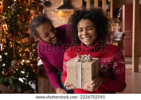 Similar – Image, Stock Photo Young couple enjoying Christmas Lights