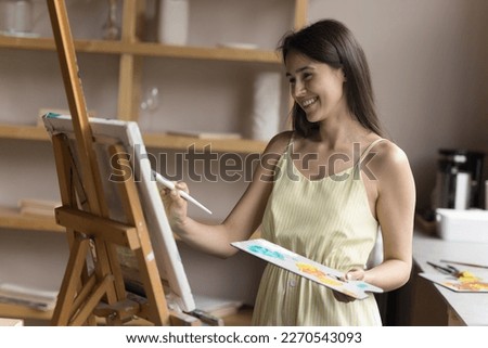 Similar – Image, Stock Photo Creative craftswoman painting picture in workshop