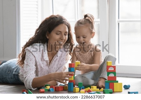 Similar – Foto Bild Zwei kleine Mädchen bauen Vogelhaus in der Garage