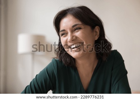 Image, Stock Photo Photo of good looking African American prosperous busineswoman waits for partner in office, drinks coffee discusses future plans with colleague looks away with cheerful expression wears formal clothes