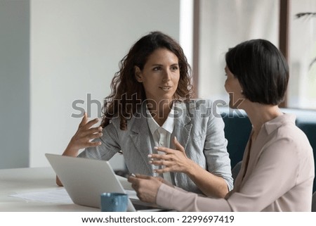 Similar – Foto Bild Zwei Frauen unterhalten sich beim Sonnenuntergang auf einer Insel. Dunkler Vordergrund mit Kanone. Blaue Wolken und mit Blick auf eine Nachbar Insel. Die Frauen sind nur als Schatten zu erkennen.