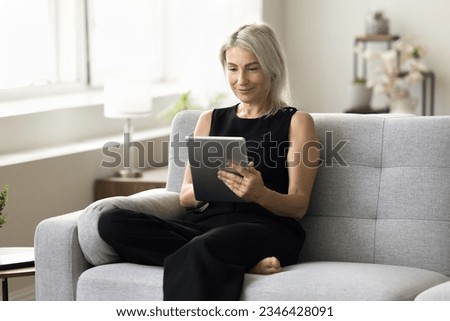 Similar – Image, Stock Photo Senior woman using tablet