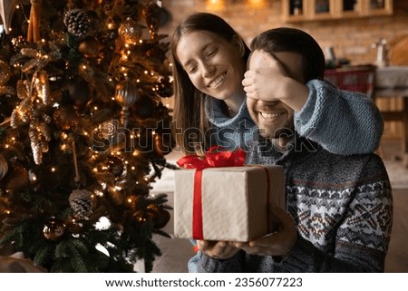 Similar – Image, Stock Photo Tree cuddling | woman hugging a pine trunk