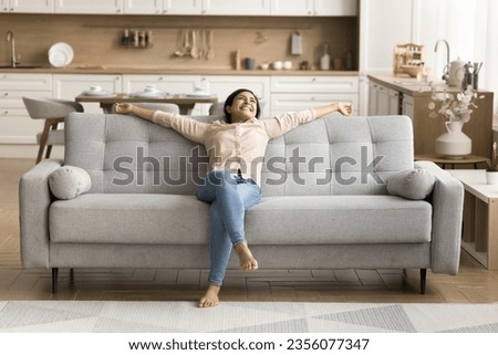 Similar – Image, Stock Photo Young female sitting on pier on nature