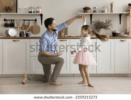 Similar – Image, Stock Photo Father with daughter barefoot on grass