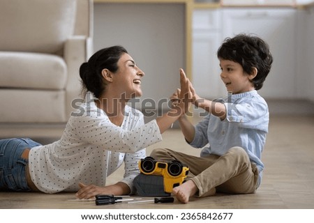 Similar – Image, Stock Photo Boy child using screwdriver at home