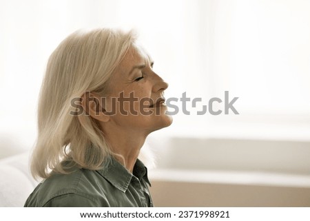 Similar – Image, Stock Photo Side view of relaxed senior woman