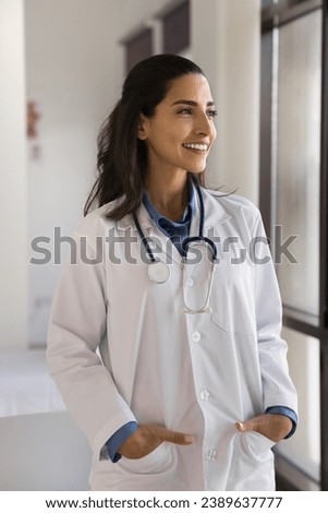 Similar – Image, Stock Photo Female doctor looking out the hospital window