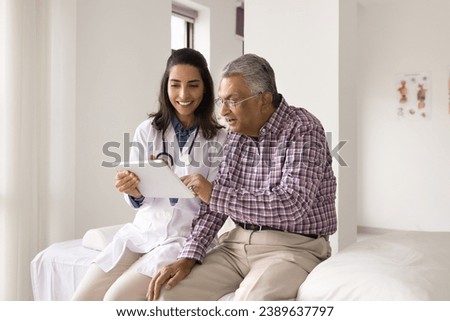 Similar – Image, Stock Photo Female doctor looking out the hospital window