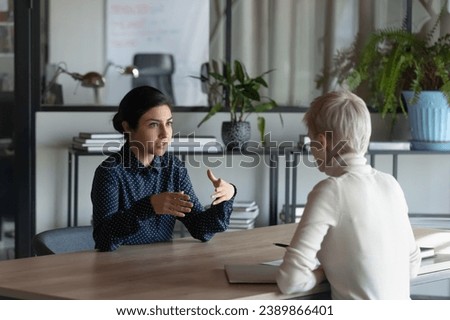 Similar – Image, Stock Photo Ethnic young women in casual clothes looking at camera with fearless eyes