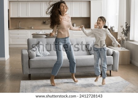 Image, Stock Photo 2 children jumping on a bouncy cushion in the park