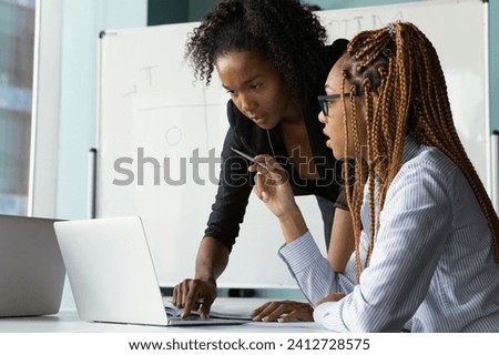 Similar – Image, Stock Photo Young black woman looking at camera with intense look