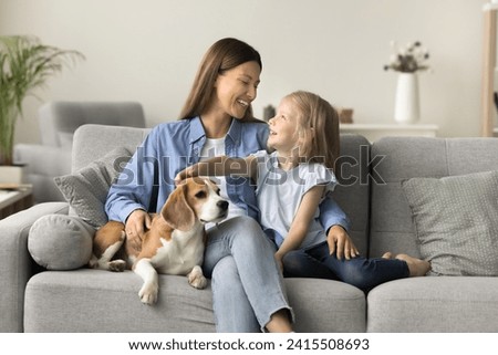 Similar – Image, Stock Photo Woman caressing adorable little kitten