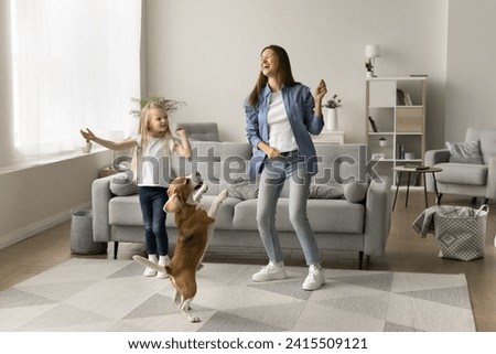 Similar – Image, Stock Photo Girl and dog with red suitcase happy for vacation