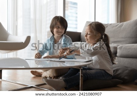 Similar – Image, Stock Photo Cute girl drawing on paper at home