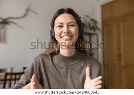 Similar – Image, Stock Photo Attractive woman with headphones showing the tattoos on her hands on a pink background