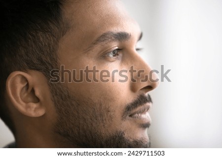 Similar – Image, Stock Photo Crop ethnic barber looking in mirror in hairdressing salon