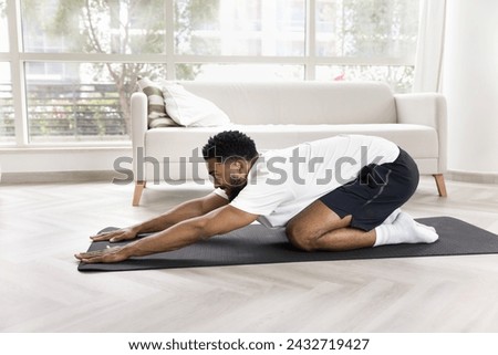 Similar – Image, Stock Photo Strong man doing yoga on beautiful ocean beach