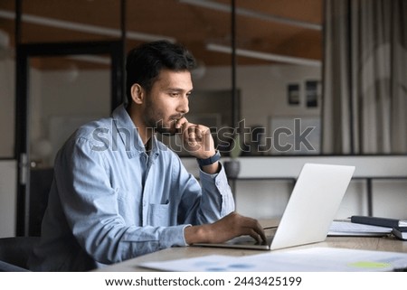 Similar – Image, Stock Photo Focused worker using laptop in office