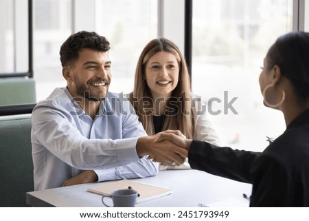 Similar – Image, Stock Photo Cheerful couple talking on video chat using laptop