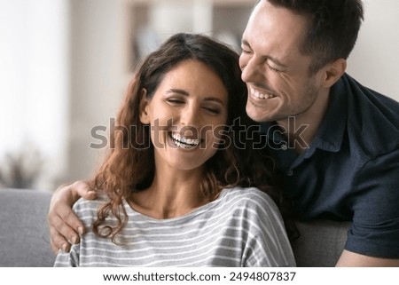 Similar – Image, Stock Photo Cheerful couple talking on video chat using laptop