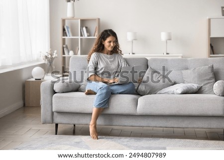 Image, Stock Photo Young female sitting on pier on nature