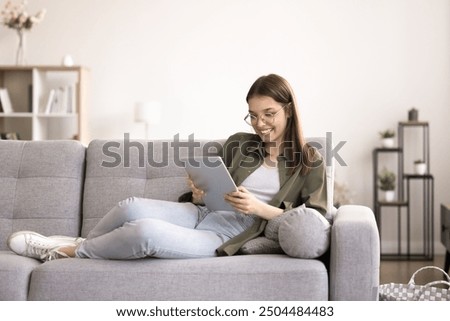 Similar – Image, Stock Photo Young female sitting on pier on nature