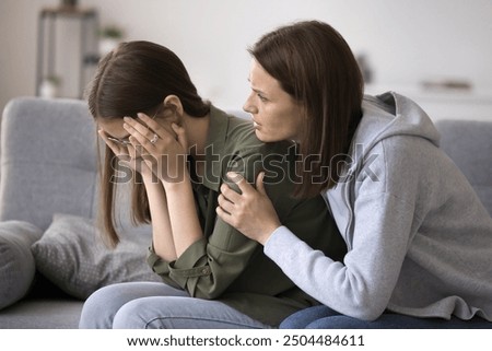 Similar – Image, Stock Photo Tender mother embracing sad son