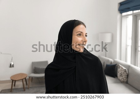 Similar – Image, Stock Photo Confident ethnic lady covering eye with hand in red studio