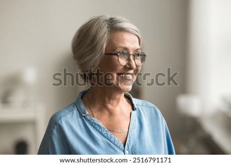 Similar – Image, Stock Photo Senior lady looking away from boardwalk