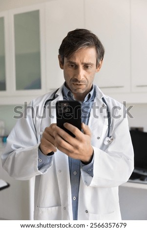 Similar – Image, Stock Photo doctor man using mobile phone. Front focus on an alcohol gel or antibacterial disinfectant. Hygiene and corona virus concept. Covid-19