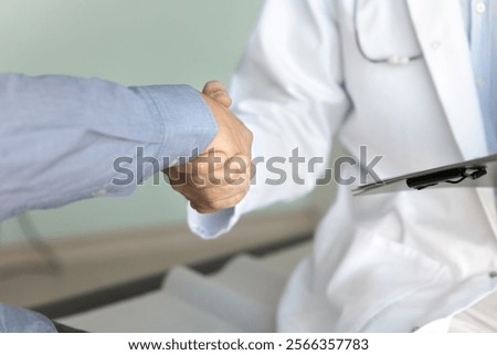 Similar – Image, Stock Photo Unrecognizable male doctor giving anesthesia to patient lying on couch before surgery