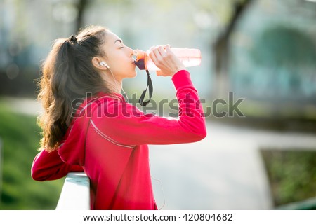 Similar – Image, Stock Photo Woman drinking isotonic drink while resting