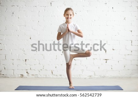 Similar – Image, Stock Photo Cheerful athletes practicing yoga together in mountain pose in contemporary workout room