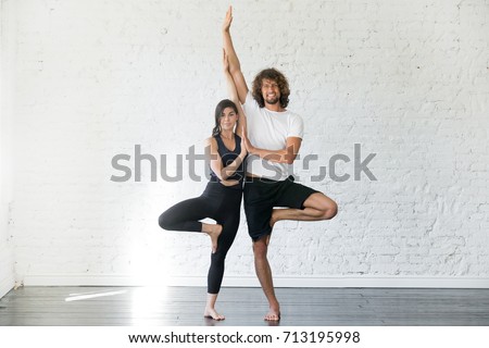 Similar – Image, Stock Photo Barefooted women practicing yoga in mountain pose