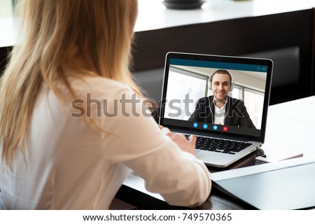 Image, Stock Photo Businesswoman having video chat on mobile phone with her colleague. Businesswoman working with data on charts, graphs and diagrams on computer screen