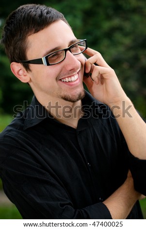 Portrait of a young man speaking on the phone