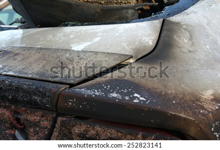 Burn sports car wreck - rear spoiler