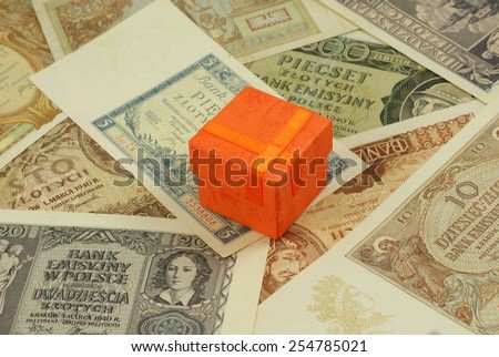Orange small box on the old, historical Polish bills, notes. Focus on some part of the image only - rest is blur by intention.