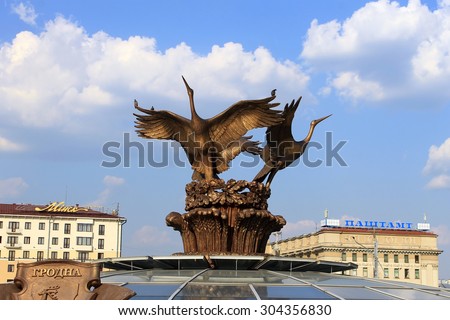 MINSK, BELARUS - August 7, 2015: three storks sculpture on fountain at Independence square