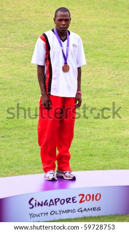 SINGAPORE - AUG. 21: Alfas Kishoyan stands on the medal podium after accepting the bronze medal on Aug. 21, 2010 in Singapore. Inaugural Youth Olympic Games, 400m event.