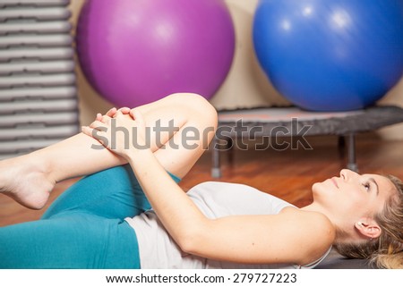 Woman lying doing yoga