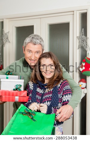 Parents holding gifts
