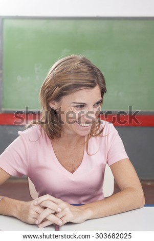 The teacher teaching and smiling