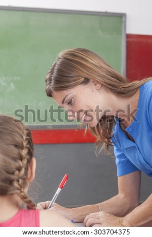 The teacher checking the homework