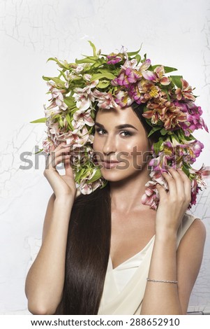 Beautiful lady with  flowers on a head