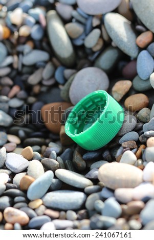 At the sea Macro image of various color items lost at the beach sea stones in Bray Greystones Ireland