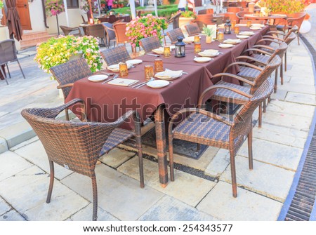 NAKORN RACHASRIMA - FEB, 19 : The classic tables and chairs are arranged for tourists.This evening have big meal for reception dinner at the resort . THAILAND  FEB,19 2015